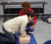 A woman demonstrates CPR techniques to another woman, emphasizing the importance of life-saving skills in emergencies_BLS certification Augusta_ACLS near me_ACLS classes near me_New AHA CPR Guidelines 2025